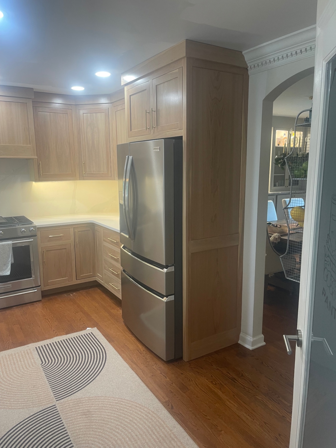 Custom whitewashed cherry kitchen cabinetry by Customs By Shelton
