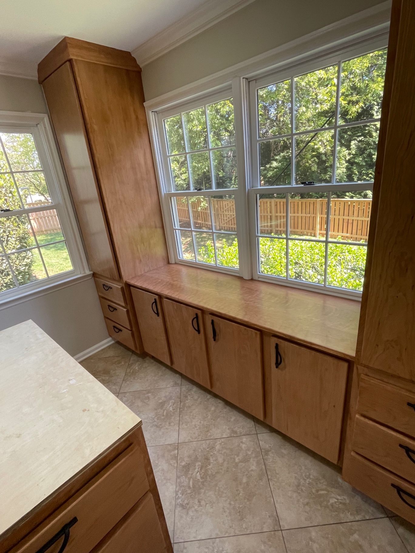 Custom window seat cabinetry by Customs By Shelton